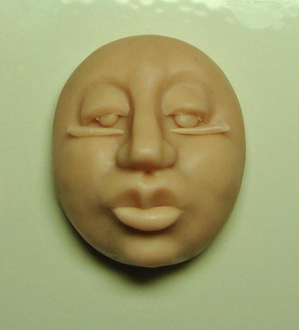Cómo moldear una cara con arcilla - Paso 16