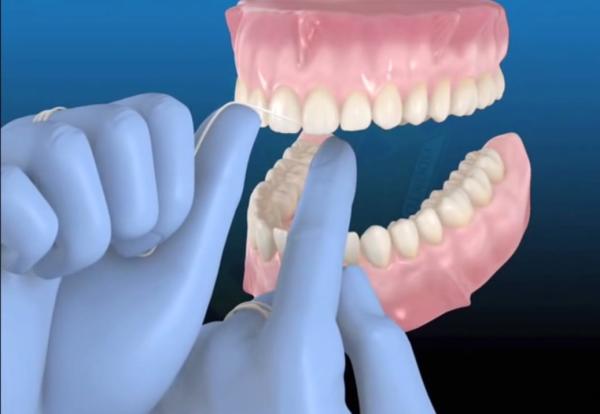 Cómo usar el hilo dental correctamente - Paso 4