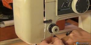 Enhebrado de una máquina de coser