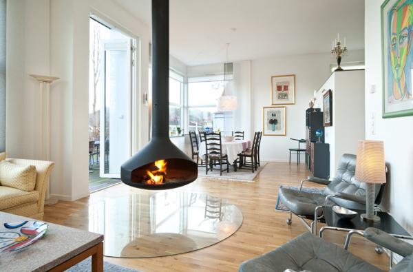 Cómo decorar un salón con chimenea - Chimeneas que se convierten en el centro del universo